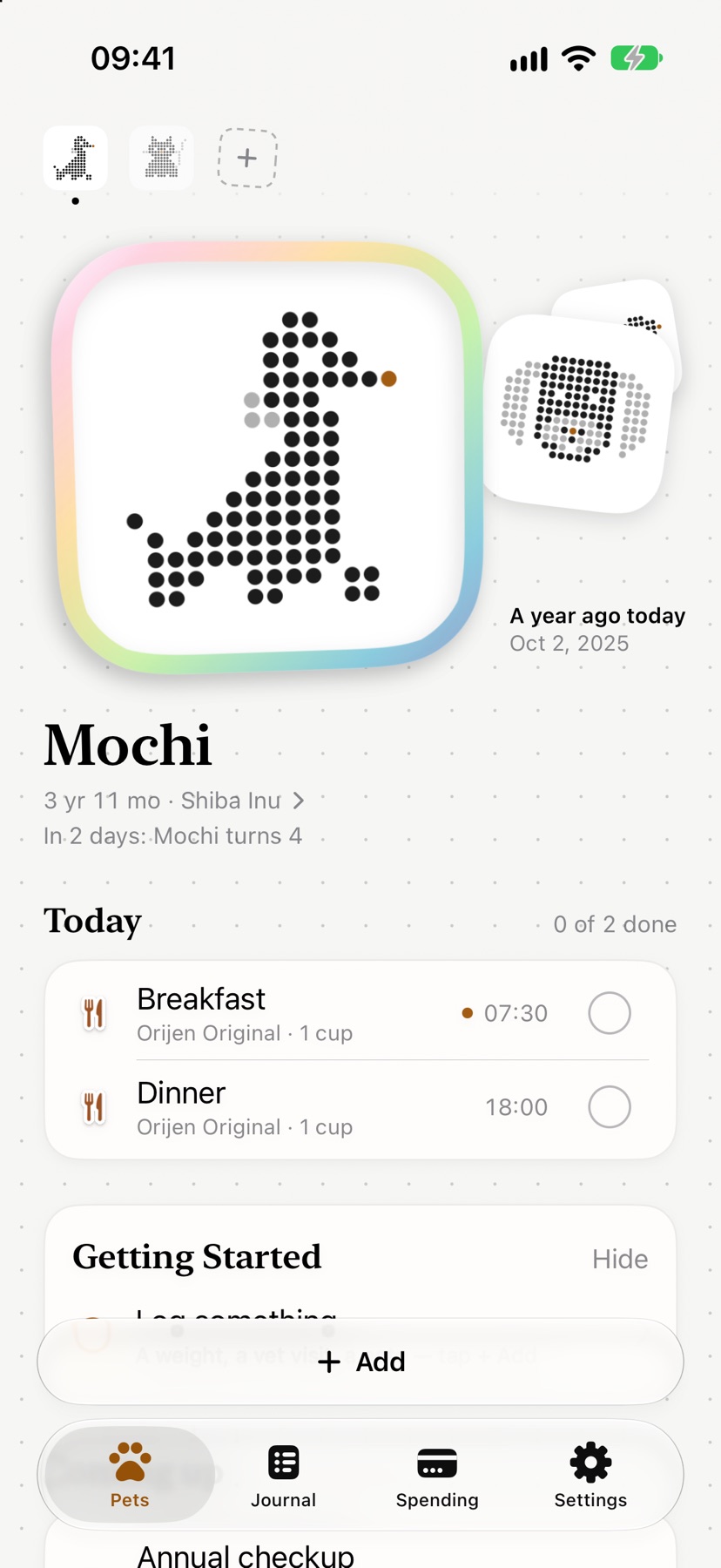 Mochi’s page in Pawdot: a big sticker, her age, and today’s breakfast and dinner waiting to be ticked off